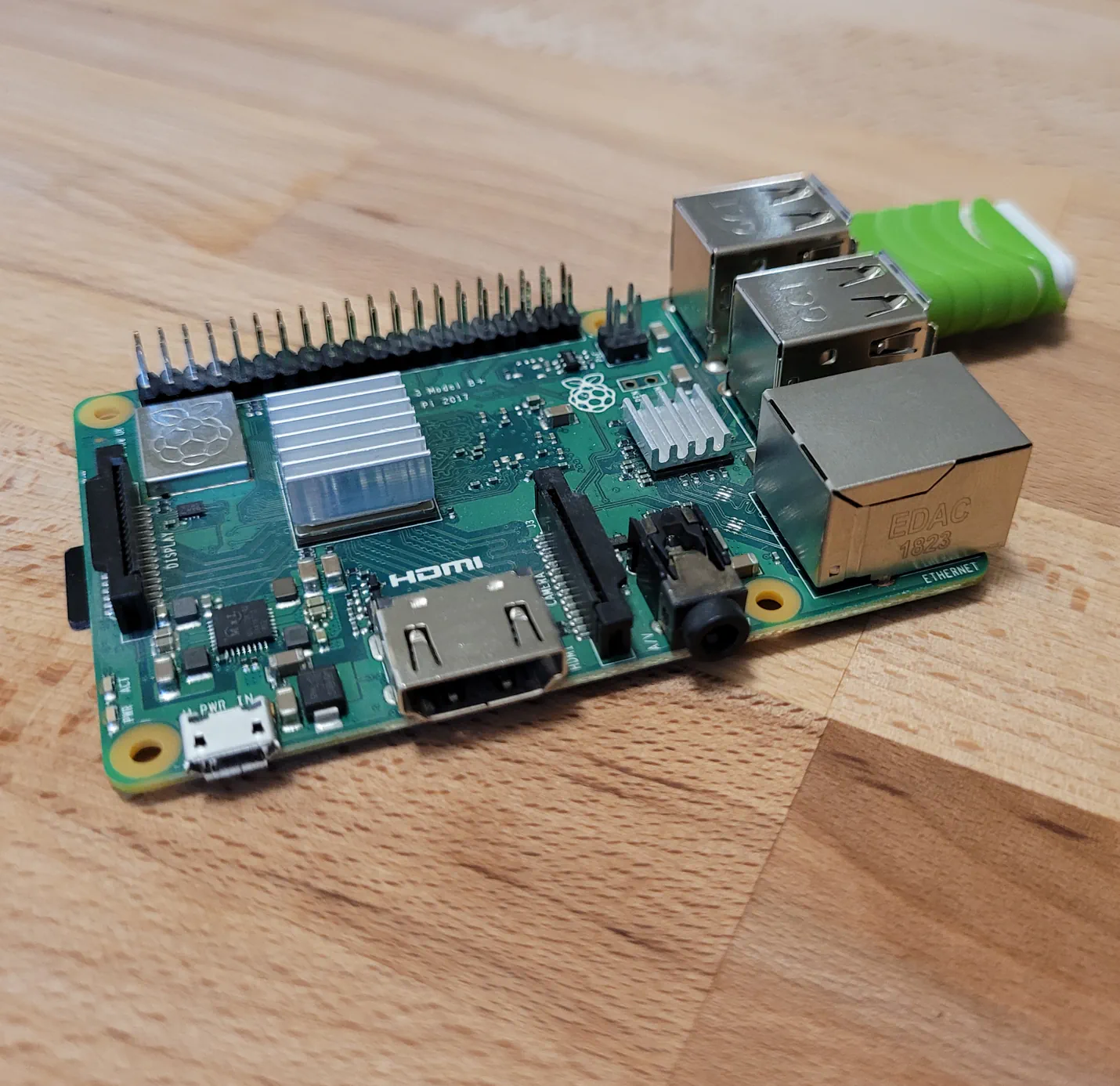 A Raspberry Pi 3+ with a USB flashdrive installed into one of the onboard USB ports.