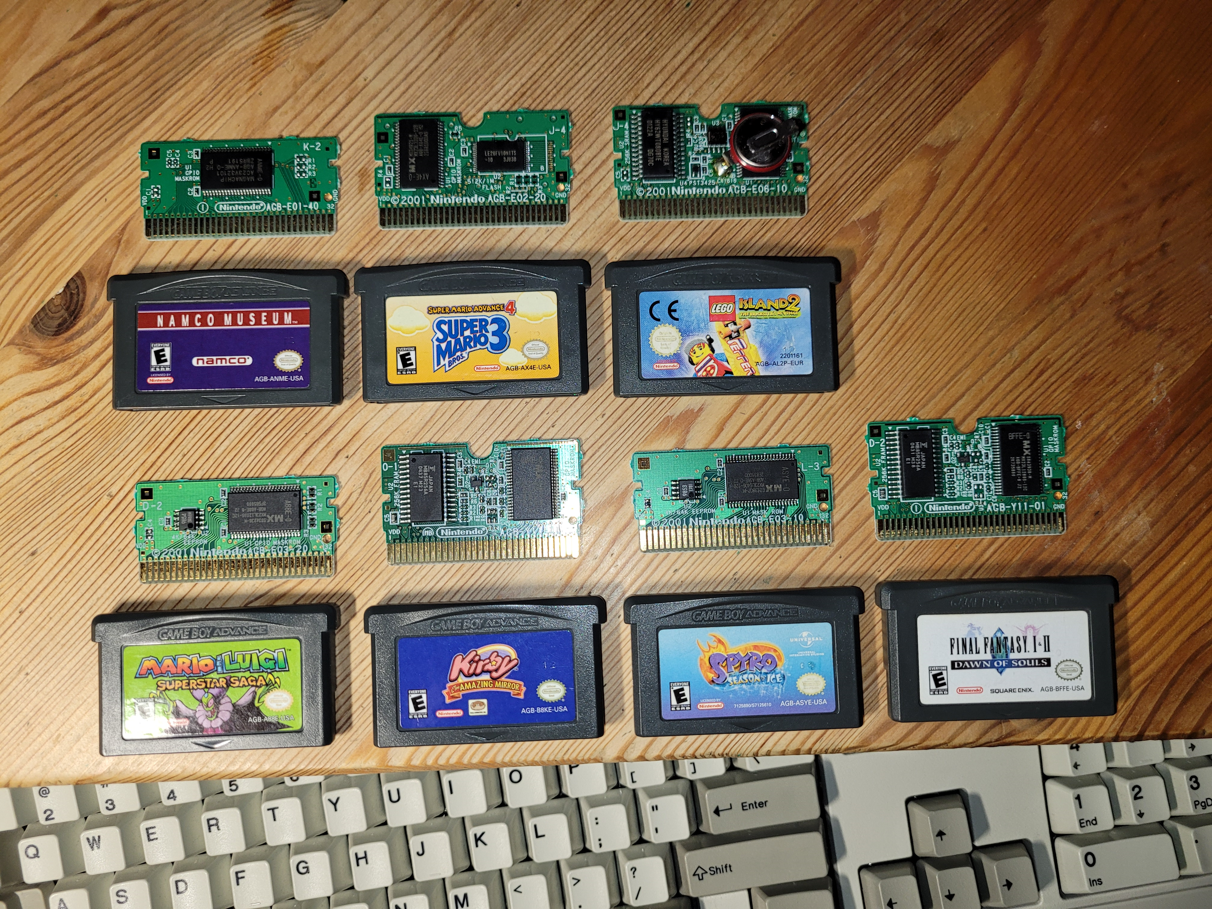 Picture of the remaining GBA games opened up with PCBs shown.